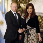 Argentina's President de Kirchner shakes hands with her Russian counterpart Putin in Buenos Aires