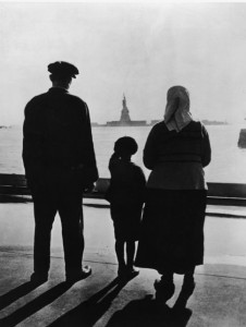 Family Views Statue Of Liberty From Ellis Island