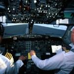 Pilots in the cockpit of an aircraft.